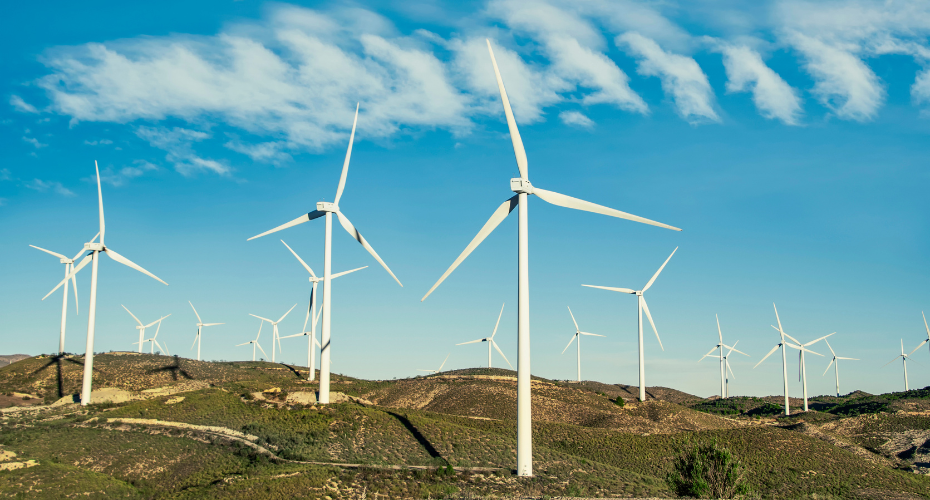 A group of wind turbines on a hillside