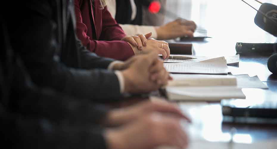 People's hands in a meeting