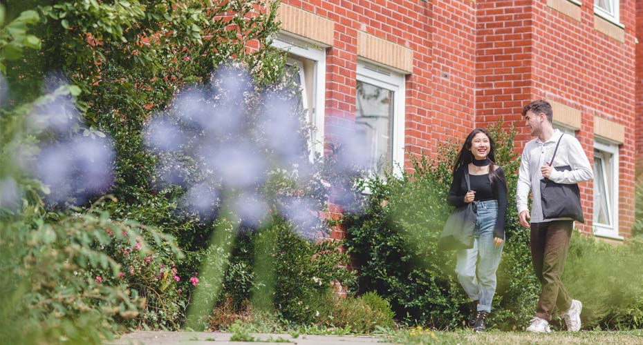 Students walking outside halls of residence