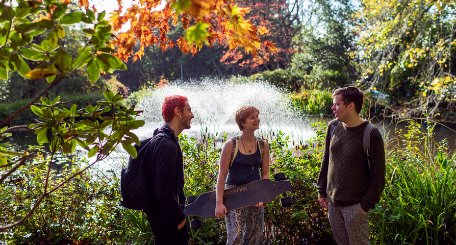 Student by a green space on campus