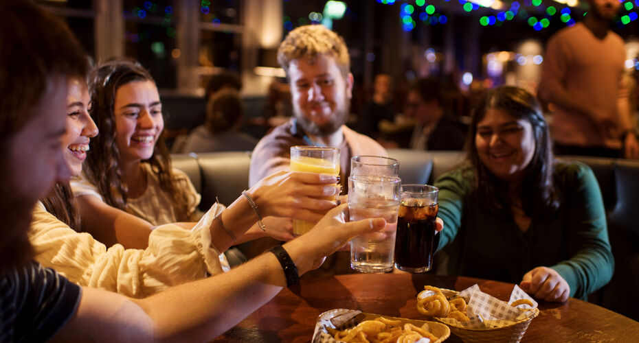 Students enjoying drinks and food in the Ram Bar